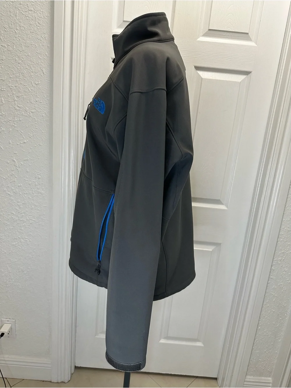 The North Face Men's Charcoal Gray Jacket with Blue Zippers